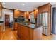 Well-appointed kitchen features stainless steel appliances, center island, and granite countertops at 6918 E Easter Pl, Centennial, CO 80112