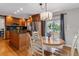Well-appointed kitchen adjoins dining area and features stainless steel appliances and a center island at 6918 E Easter Pl, Centennial, CO 80112