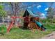 Outdoor playset with slide, climbing wall and covered area offers backyard fun at 6918 E Easter Pl, Centennial, CO 80112