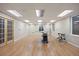 Spacious basement with recessed lighting, laminate floors, and french doors at 2085 Cactus Bloom Ct, Castle Rock, CO 80109