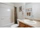Bathroom featuring shower over tub, tiled floors, toilet and sink with framed mirror at 2085 Cactus Bloom Ct, Castle Rock, CO 80109