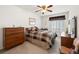 Bedroom features neutral carpet, ceiling fan and window with wooden blinds at 2085 Cactus Bloom Ct, Castle Rock, CO 80109