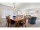 Open dining room with a chandelier and view into the living room at 2085 Cactus Bloom Ct, Castle Rock, CO 80109