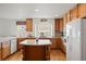 Bright kitchen with a large island, ample counter space, modern appliances, and open layout at 2085 Cactus Bloom Ct, Castle Rock, CO 80109
