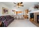 Spacious living room with an open layout leading to the kitchen and a fireplace at 2085 Cactus Bloom Ct, Castle Rock, CO 80109