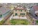 Aerial view of a private backyard with a patio, landscaping, and fence at 7763 S Elk St, Aurora, CO 80016