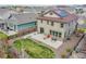Aerial view of a private backyard with a patio, landscaping, and fence at 7763 S Elk St, Aurora, CO 80016