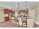 Spacious kitchen island with granite countertops and pendant lighting at 7763 S Elk St, Aurora, CO 80016