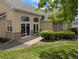 Beautiful backyard with a patio, manicured landscaping, and mature trees, ideal for outdoor living at 1343 Villa Grv, Monument, CO 80132