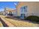 Outdoor space with brick patio, sliding glass door, and a bush at 1343 Villa Grv, Monument, CO 80132