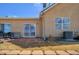 Outdoor space featuring a brick patio, sliding glass door, and a window at 1343 Villa Grv, Monument, CO 80132