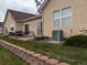 The backyard features a brick retaining wall, small patio, and space for outdoor relaxation at 1343 Villa Grv, Monument, CO 80132