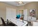 Neutral bedroom featuring carpet, ceiling fan, and double-door closet - setup as an office at 1343 Villa Grv, Monument, CO 80132