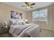 Bedroom with neutral carpet, ceiling fan, and window at 1343 Villa Grv, Monument, CO 80132