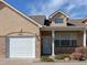 Inviting home featuring a one-car garage and covered front porch at 1343 Villa Grv, Monument, CO 80132