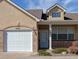 Charming home exterior with a well-maintained front yard and attached garage at 1343 Villa Grv, Monument, CO 80132