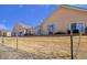 Exterior view of the home featuring a brick retaining wall and a sliding glass door at 1343 Villa Grv, Monument, CO 80132