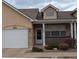 Charming home featuring a well-maintained lawn, front porch, and attached garage at 1343 Villa Grv, Monument, CO 80132