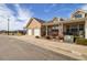 Charming front yard features a covered porch, manicured landscaping, and a two-car garage at 1343 Villa Grv, Monument, CO 80132