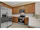 Well lit kitchen with stainless steel appliances and light countertops at 1343 Villa Grv, Monument, CO 80132