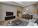 Bright living room featuring hardwood floors, dining area, and stylish contemporary furnishings at 1343 Villa Grv, Monument, CO 80132
