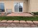 Brick patio with sliding glass doors and a small retaining wall offers outdoor entertaining at 1343 Villa Grv, Monument, CO 80132