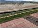 Brick patio with retaining wall overlooking the adjacent undeveloped land at 1343 Villa Grv, Monument, CO 80132