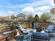 A beautiful deck featuring comfortable outdoor seating, lush greenery, and a blue rug at 2468 Candleglow St, Castle Rock, CO 80109