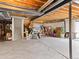 An unfinished basement with concrete floor, exposed ceiling and support structure at 2468 Candleglow St, Castle Rock, CO 80109