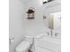 Bathroom featuring a white vanity with a modern vessel sink and round mirror at 2468 Candleglow St, Castle Rock, CO 80109