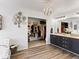 Bathroom featuring a dual sink vanity, a walk-in closet, and a chandelier at 2468 Candleglow St, Castle Rock, CO 80109