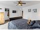 A relaxing bedroom with ceiling fan, tv, closet, and a comfortable bed with stylish bedding at 2468 Candleglow St, Castle Rock, CO 80109