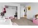 A cozy bedroom featuring a closet, white walls, and carpet flooring at 2468 Candleglow St, Castle Rock, CO 80109