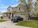 Charming two-story home with a well-maintained front yard, covered porch and driveway at 2468 Candleglow St, Castle Rock, CO 80109