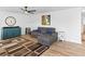 Comfortable living room with hardwood floors, neutral colors, modern decor, and ample natural light at 2468 Candleglow St, Castle Rock, CO 80109