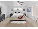 Spacious main bedroom with elegant furnishings, neutral carpet, and a ceiling fan at 2468 Candleglow St, Castle Rock, CO 80109