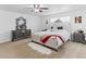 Elegant main bedroom featuring stylish furnishings, a faux fur rug, and neutral carpet at 2468 Candleglow St, Castle Rock, CO 80109