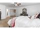 Cozy main bedroom featuring neutral carpet, neutral walls, and an open closet door at 2468 Candleglow St, Castle Rock, CO 80109