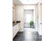 Well-lit bathroom with tiled walk-in shower featuring a bench and a decorative green plant at 5917 Black Forest Dr, Elizabeth, CO 80107