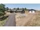 Expansive ranch-style home with a large garage/workshop on a spacious lot with a long driveway and mature trees at 5917 Black Forest Dr, Elizabeth, CO 80107