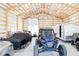 Spacious garage filled with cars and equipment, featuring wood frame construction at 5917 Black Forest Dr, Elizabeth, CO 80107