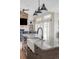 Kitchen island with granite countertops and stainless steel sink with a view of the living space at 5917 Black Forest Dr, Elizabeth, CO 80107