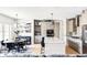 Modern kitchen featuring an island with seating, stainless steel appliances, and adjacent dining area at 5917 Black Forest Dr, Elizabeth, CO 80107