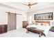 Bright main bedroom with a ceiling fan, wood accents, and stylish decor at 5917 Black Forest Dr, Elizabeth, CO 80107