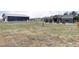 An extensive yard featuring a large barn and a well-kept home with beautiful landscaping at 5917 Black Forest Dr, Elizabeth, CO 80107