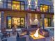 Cozy outdoor patio with fire pit and comfortable seating, perfect for entertaining guests and relaxing in the evenings at 7793 Elk Path Way, Morrison, CO 80465