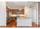 Well-lit kitchen with stainless steel appliances, granite countertops, and warm wood cabinets at 10111 Inverness Main St # 210, Englewood, CO 80112