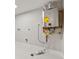 Basement laundry area with Rinnai tankless water heater at 2995 Ivanhoe St, Denver, CO 80207