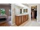 Primary bathroom features a dual sink vanity and walk-in closet at 7126 E 162Nd Ct, Brighton, CO 80602