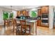 Bright kitchen with a spacious island, stainless steel appliances, and wood cabinets at 7126 E 162Nd Ct, Brighton, CO 80602